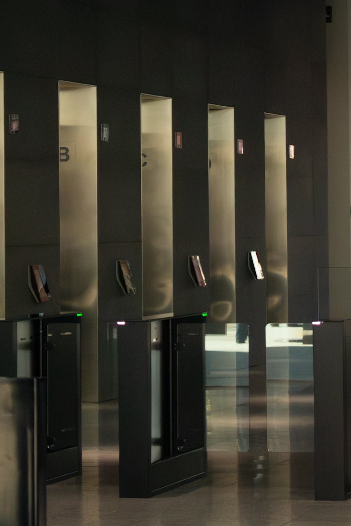 Sleek turnstiles in a modern office building lobby. Ideal for security-themed projects.